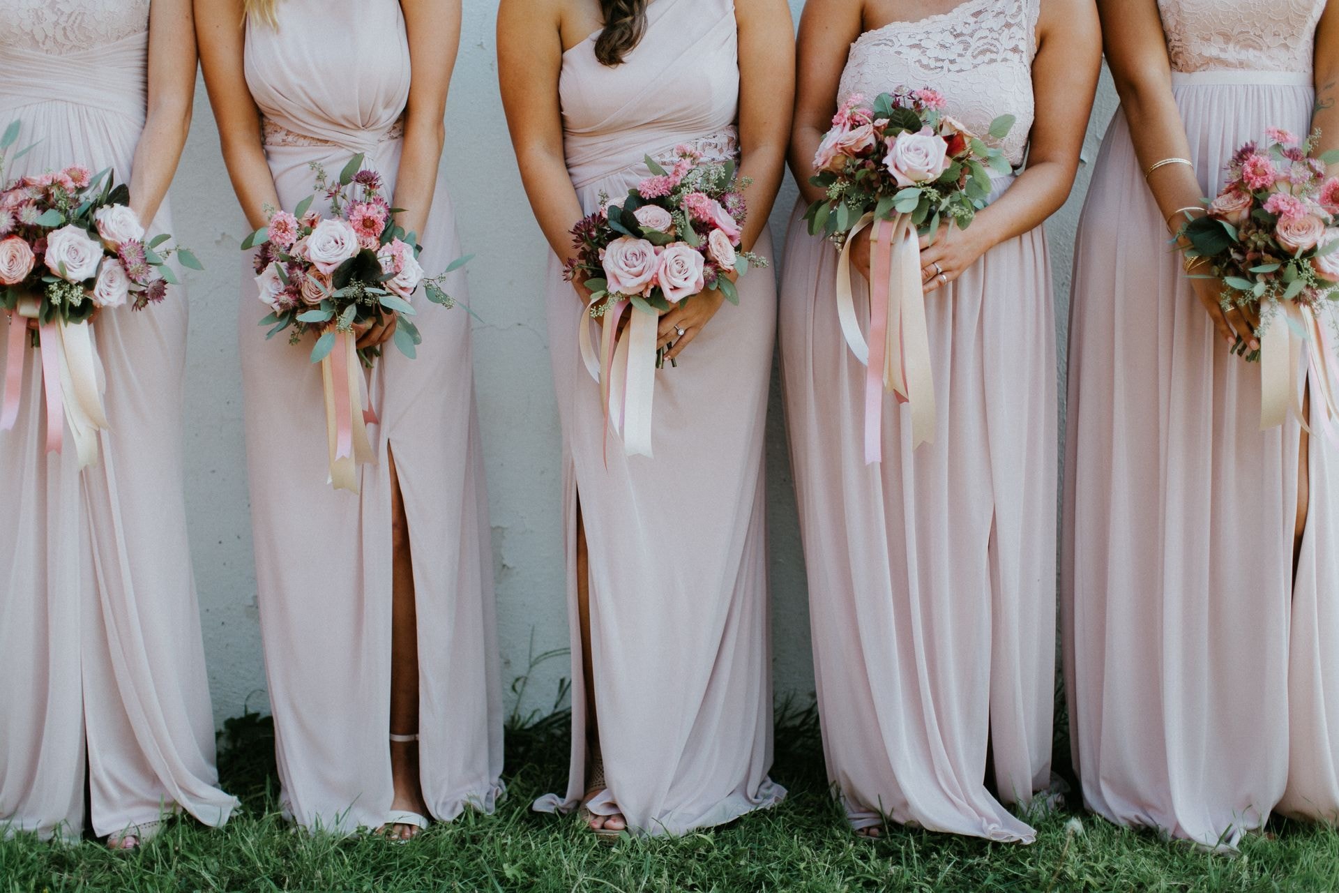 Bridesmaids in coordinated custom dresses