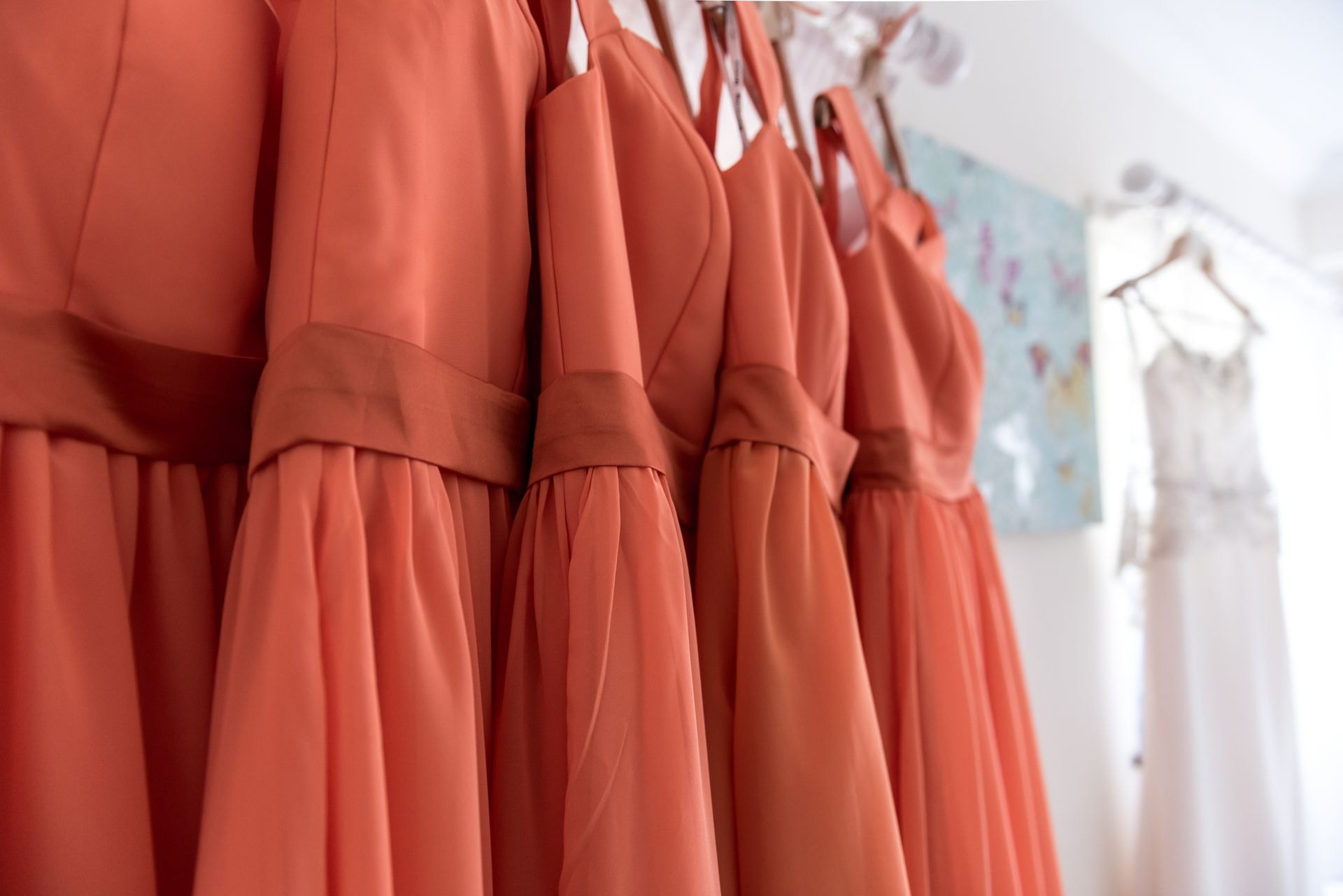 Coral bridesmaid dresses on display