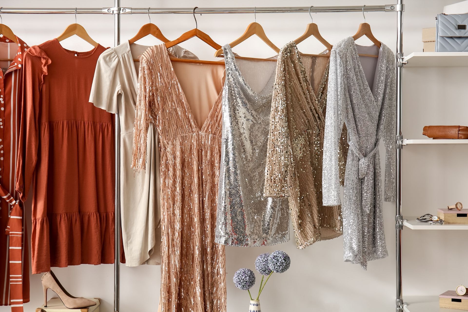Custom prom dresses displayed on hangers