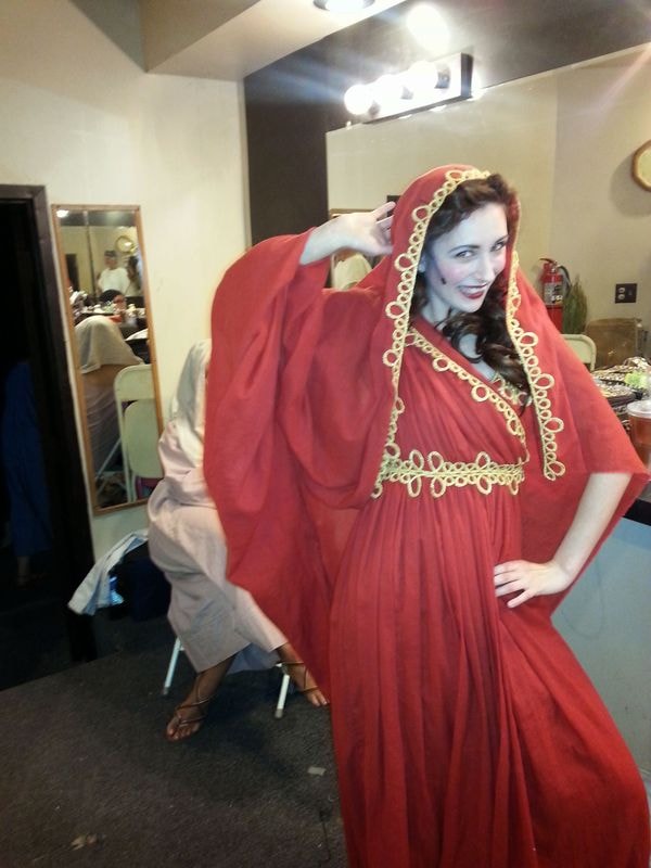 Woman wearing red traditional draped gown