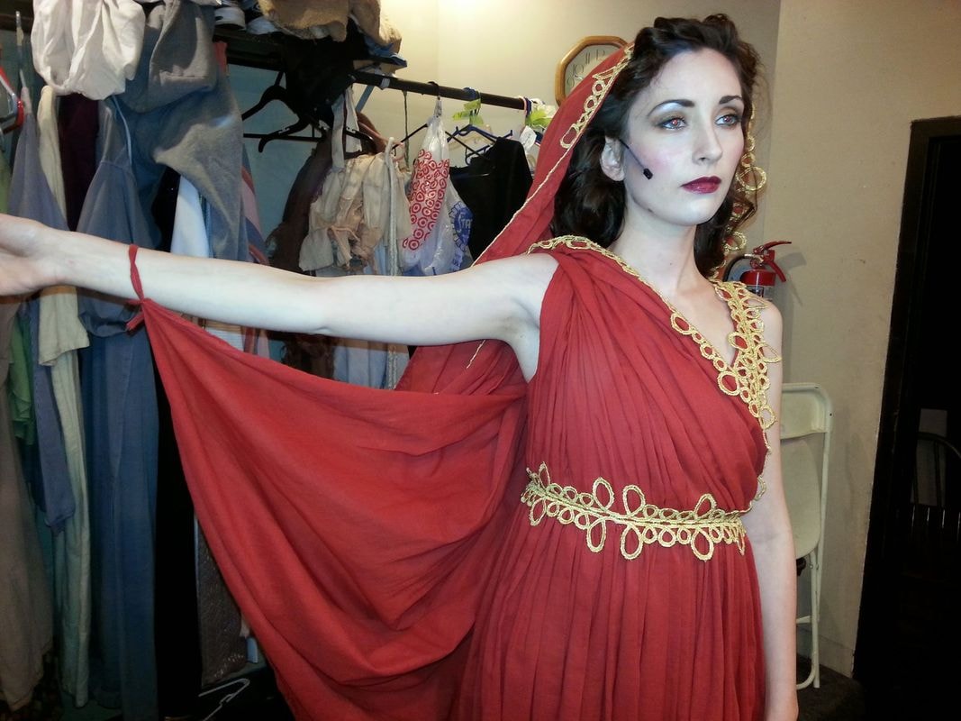 Woman modeling red ancient Greek costume
